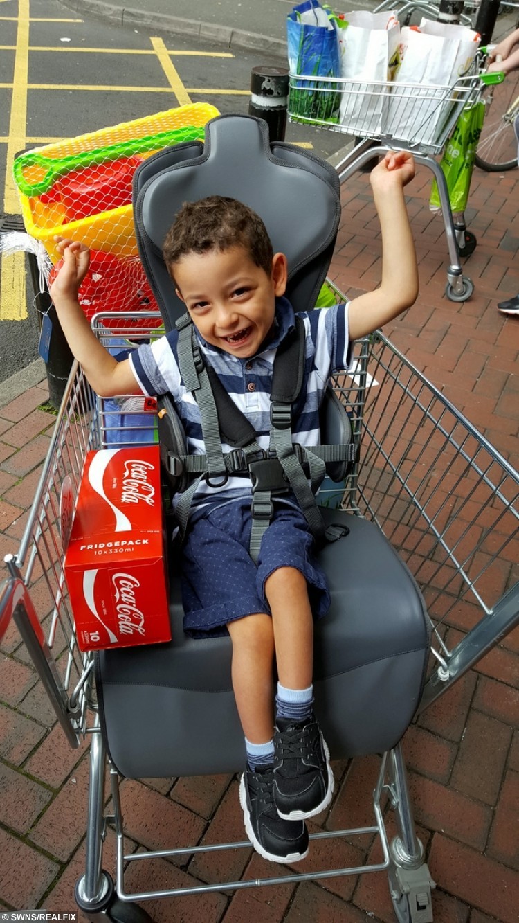 VIRAL PIC OF DELIGHTED DISABLED LAD AFTER FIRST RIDE IN SUPERMARKET TROLLEY