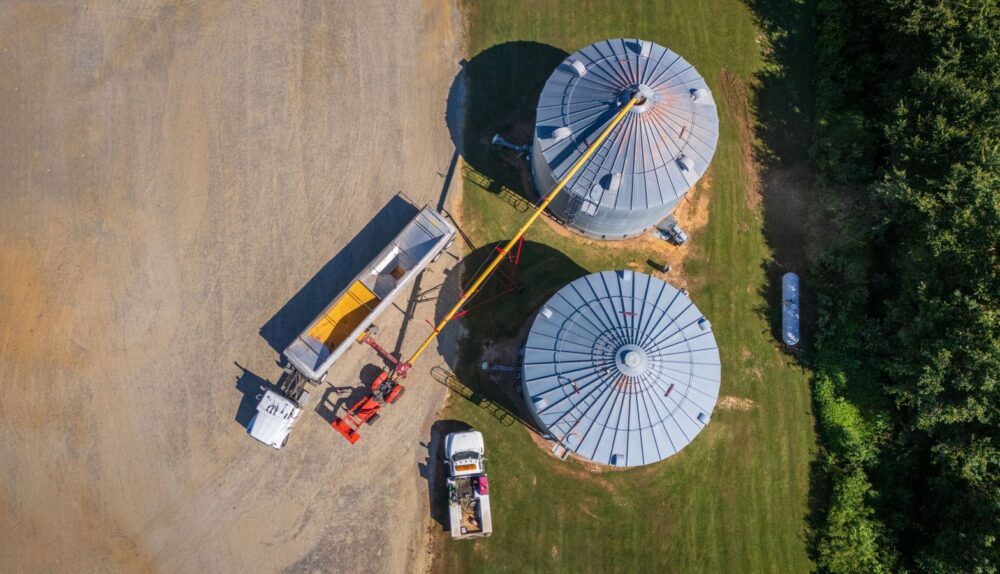 Grain storage bins and auger on a farm