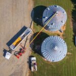 Grain storage bins and auger on a farm