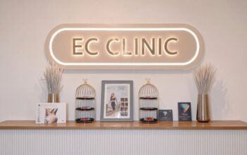 The illuminated EC Clinic sign above the reception counter at EC Clinic London