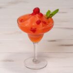 Strawberry and raspberry frozen daiquiri garnished with mint