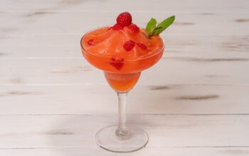 Strawberry and raspberry frozen daiquiri garnished with mint
