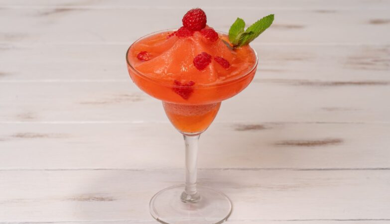 Strawberry and raspberry frozen daiquiri garnished with mint